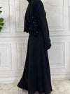 Vue latérale d&#39;une abaya kimono noir ébène avec coupe longue et fluide