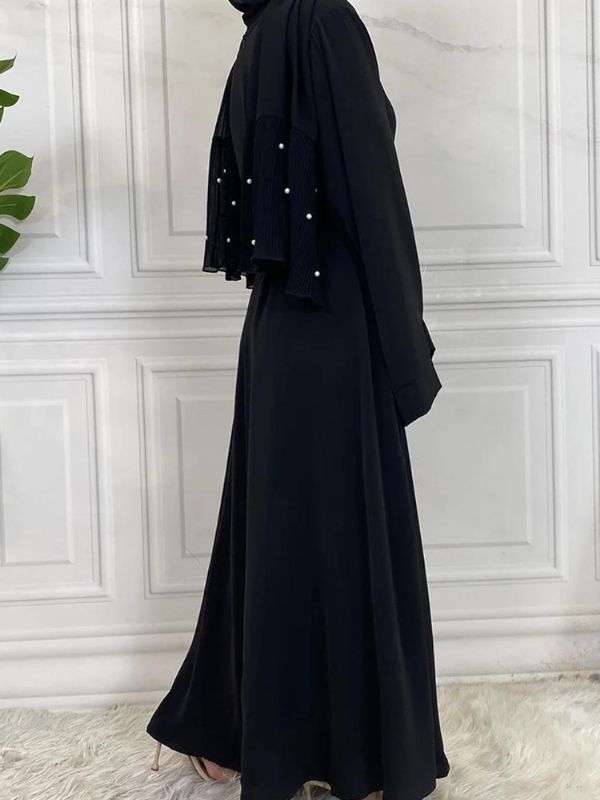 Vue latérale d&#39;une abaya kimono noir ébène avec coupe longue et fluide
