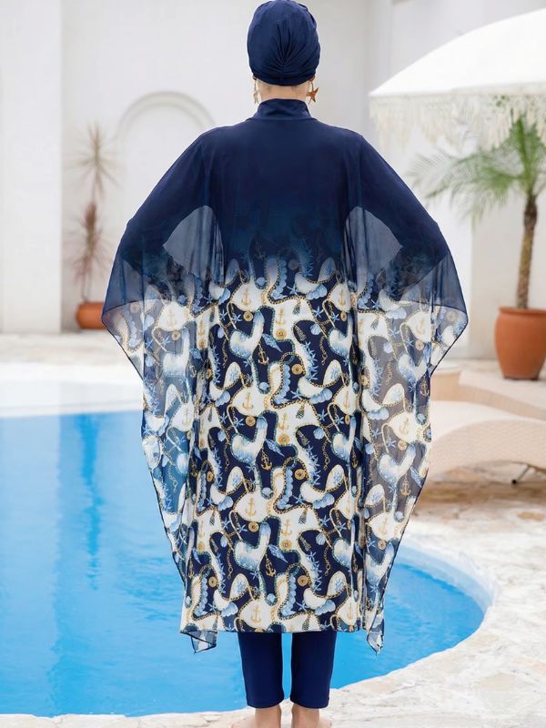 Dos du burkini hijab marine, voile des manches cape et décor d'ancres dorées sur le bas de la tunique